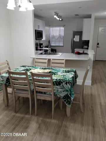 a kitchen with a table and chairs in it