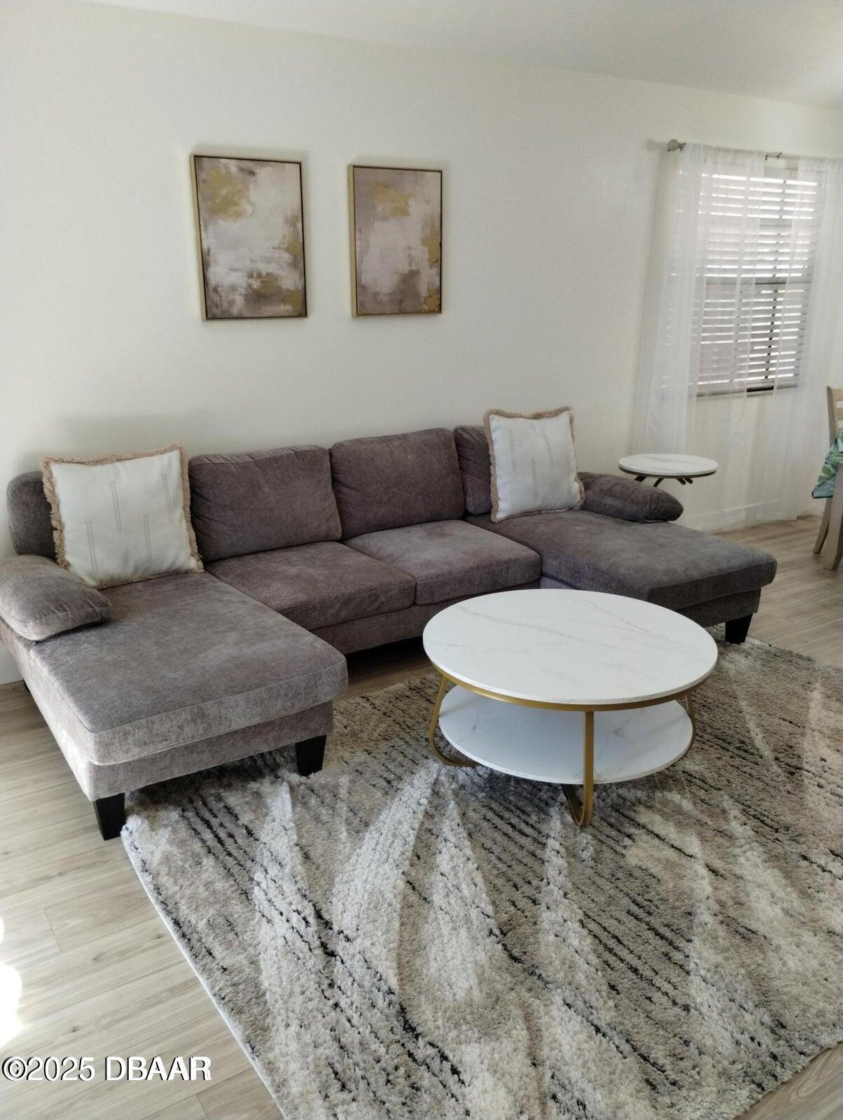 962 Stonybrook Circle Port Orange, FL 32127 - Photo 3 of 15 a living room with furniture and a window