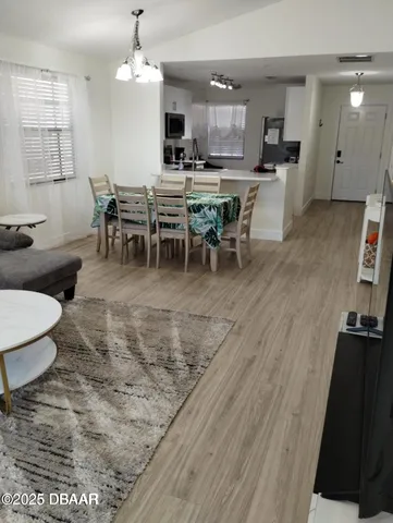 a view of a dining room with furniture