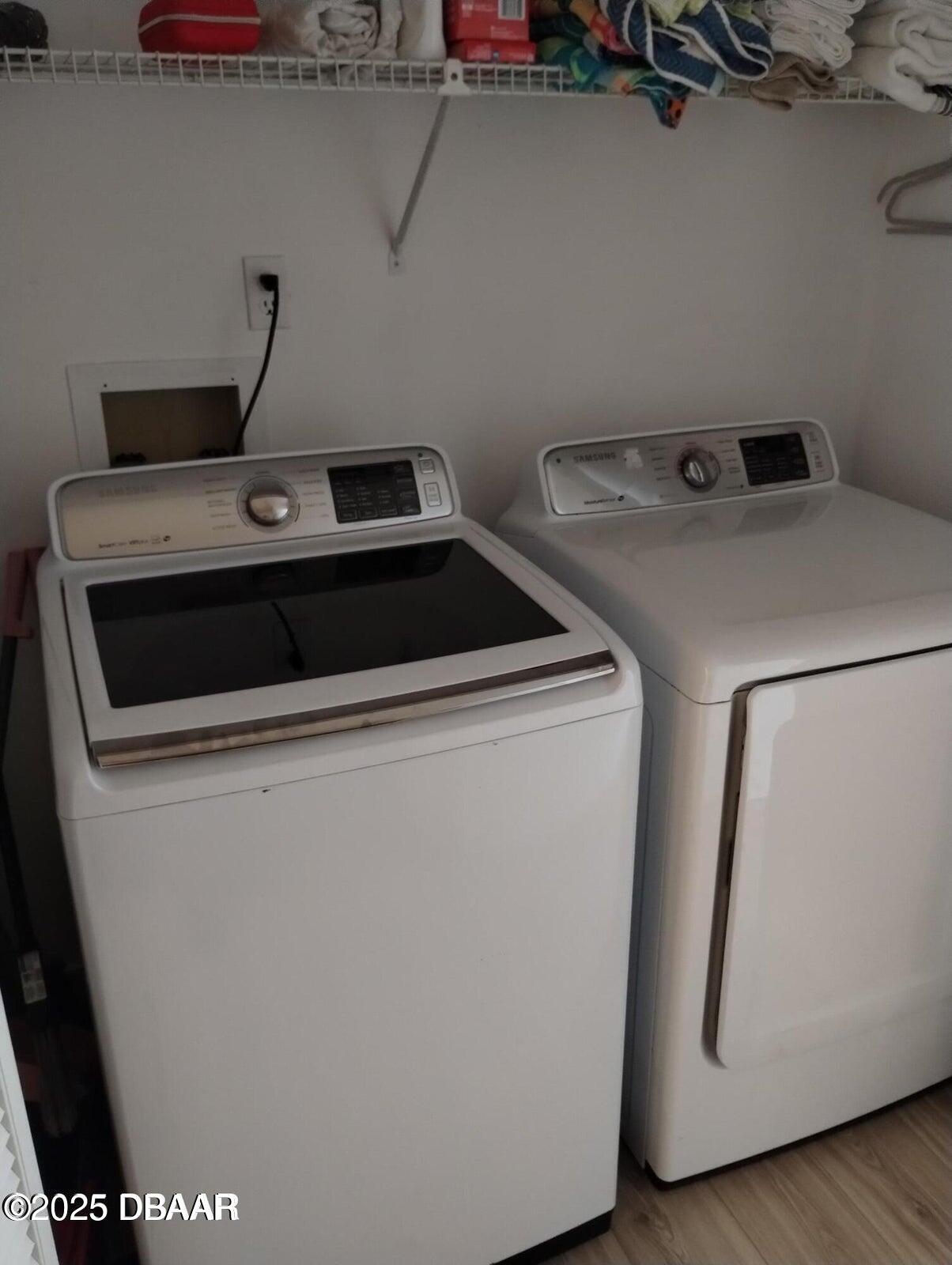 962 Stonybrook Circle Port Orange, FL 32127 - Photo 8 of 15 a utility room with dryer and washer