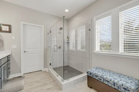 a bedroom with furniture and window