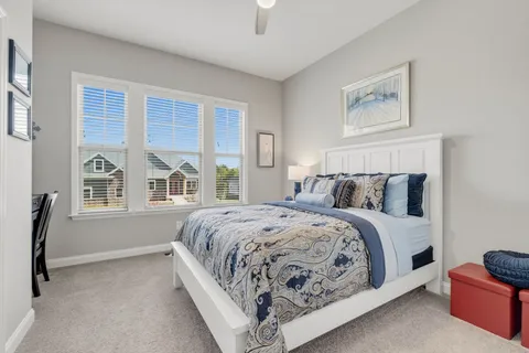 a bedroom with a bed and a table in it