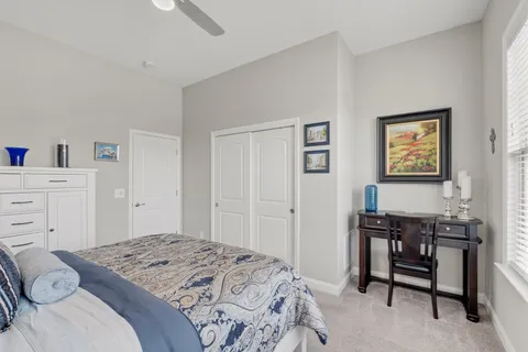 a bedroom with a bed and window