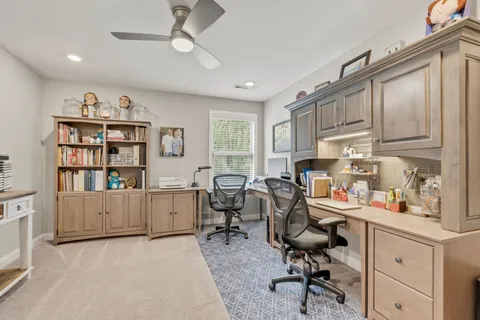 a view of a workspace with furniture