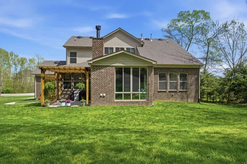 a view of a table and chairs under an umbrella