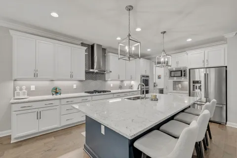 a large kitchen island with a table and chairs