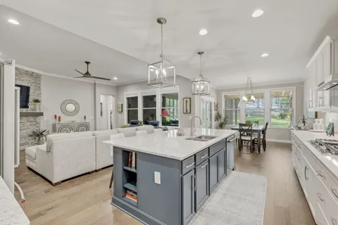 a kitchen with cabinets stainless steel appliances and cabinets