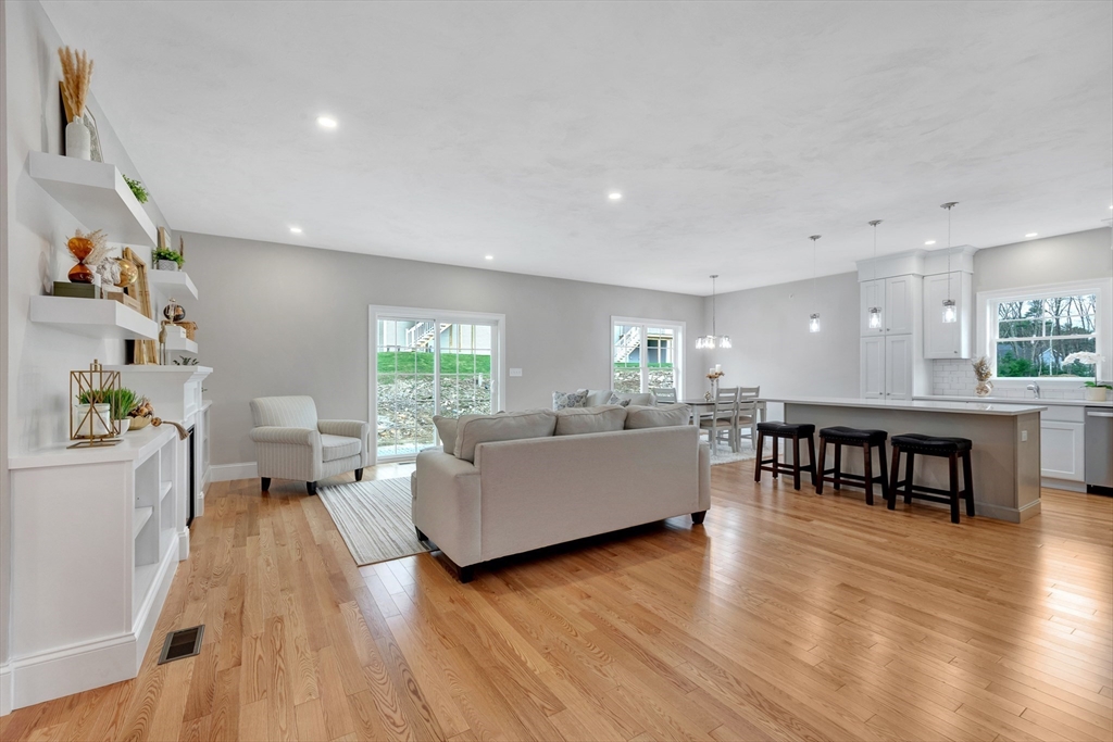 8 Weber Farm Road, Unit 8 Wrentham, MA 02093 - Photo 5 of 35 a living room with furniture and a wooden floor