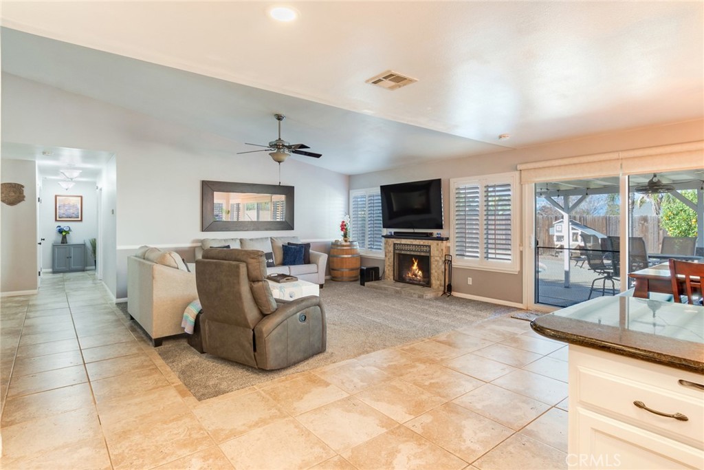 701 West Crestview Street Corona, CA 92882 - Photo 12 of 35 Digitally enhanced flames in fireplace