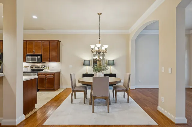 a view of kitchen with dining room and wooden floor