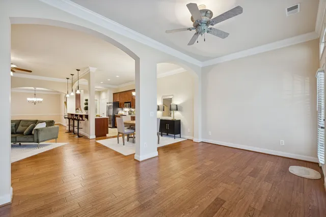 a kitchen with stainless steel appliances granite countertop a stove refrigerator sink and microwave