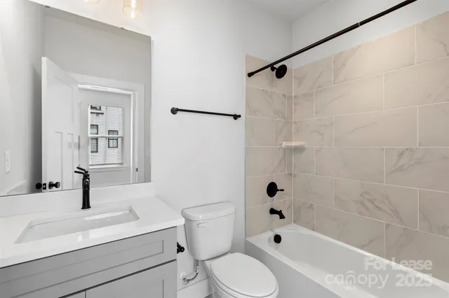 a bathroom with a sink a toilet and a bathtub