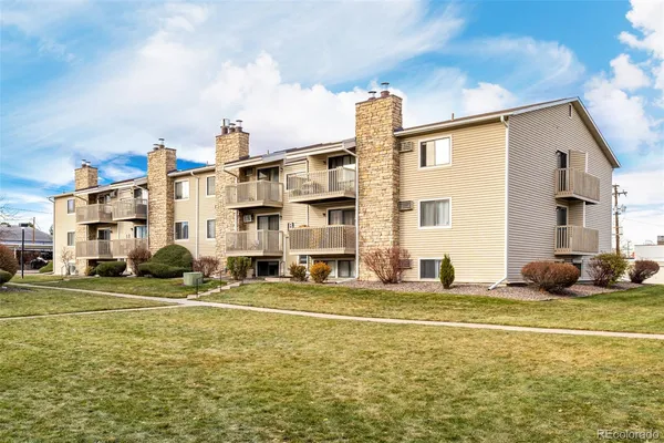 a view of a building with a backyard
