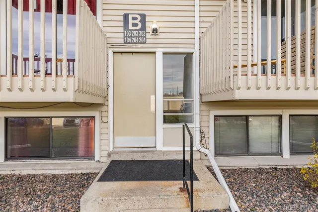 a front view of a house with large windows