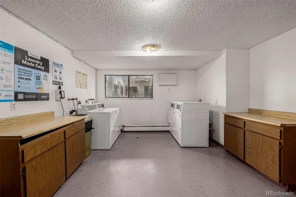 a kitchen with cabinets and white appliances