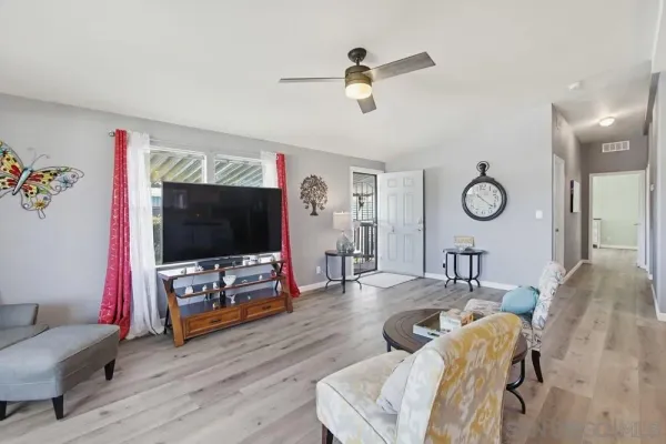 a kitchen with a dining table chairs and white appliances