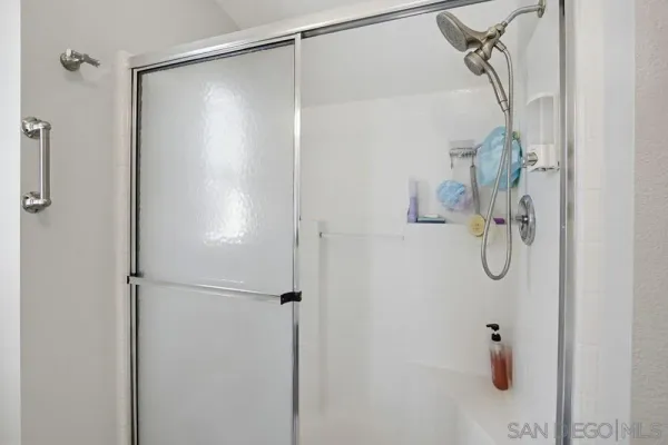 a room with a bed and a flat screen tv