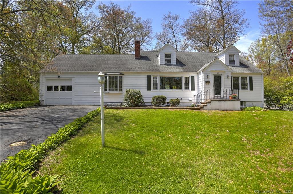 135 Lockwood Road Fairfield, CT 06825 - Photo 1 of 1 a view of a house with a big yard plants and large trees