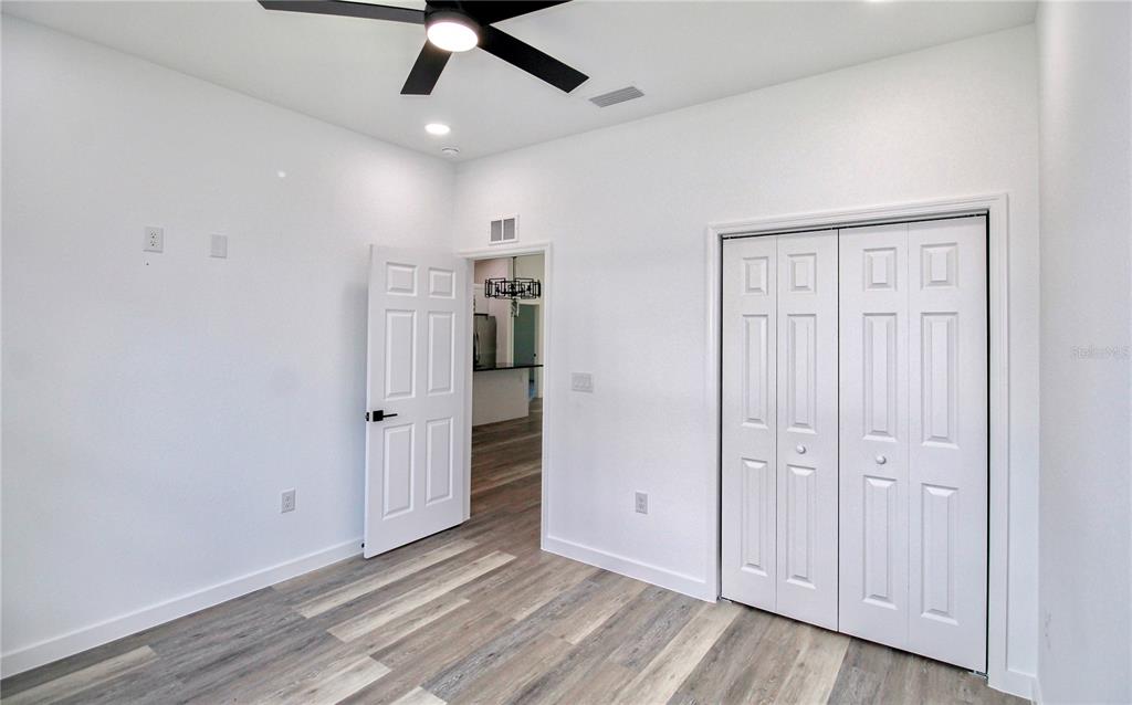 454 Bonnie Road Northwest Lake Placid, FL 33852 - Photo 24 of 30 wooden floor in an empty room