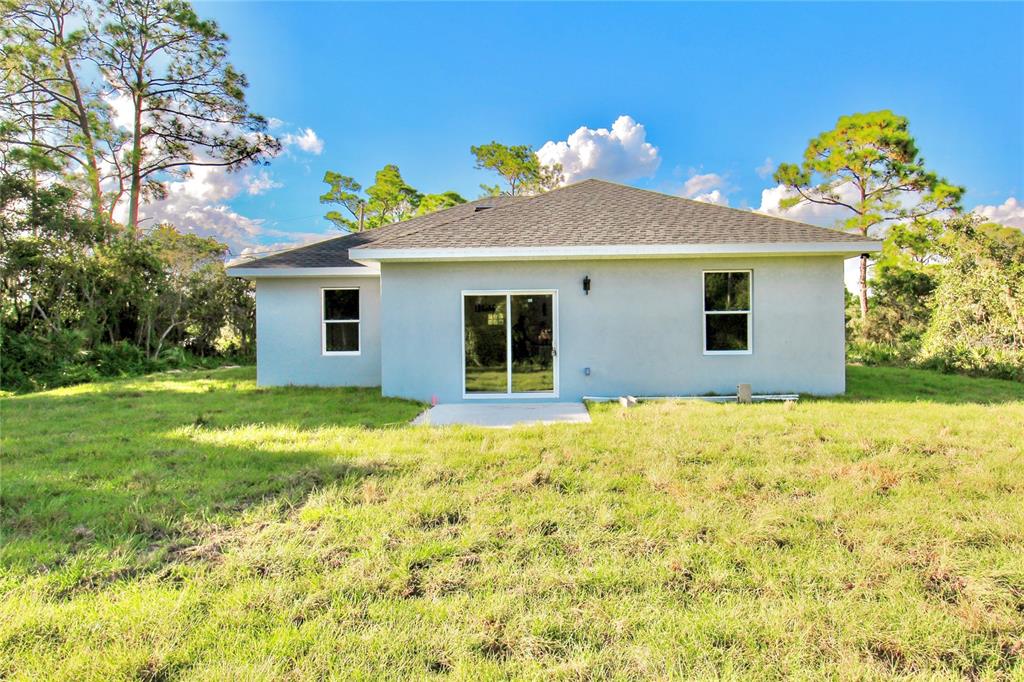 454 Bonnie Road Northwest Lake Placid, FL 33852 - Photo 30 of 30 a view of a house with a yard