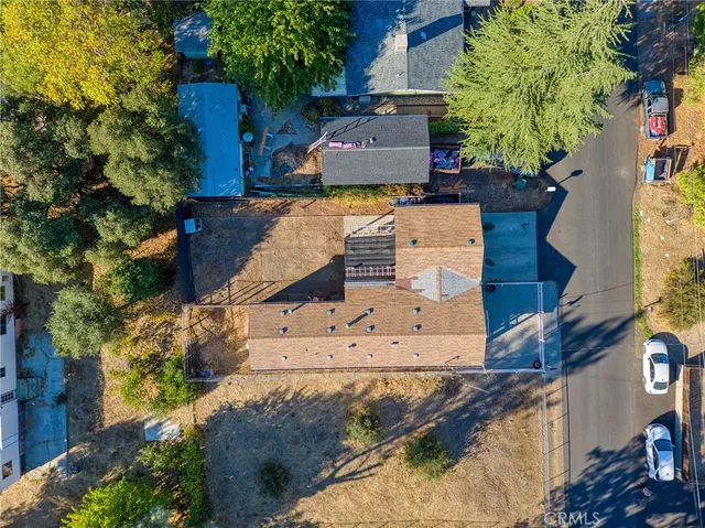an aerial view of residential houses with outdoor space