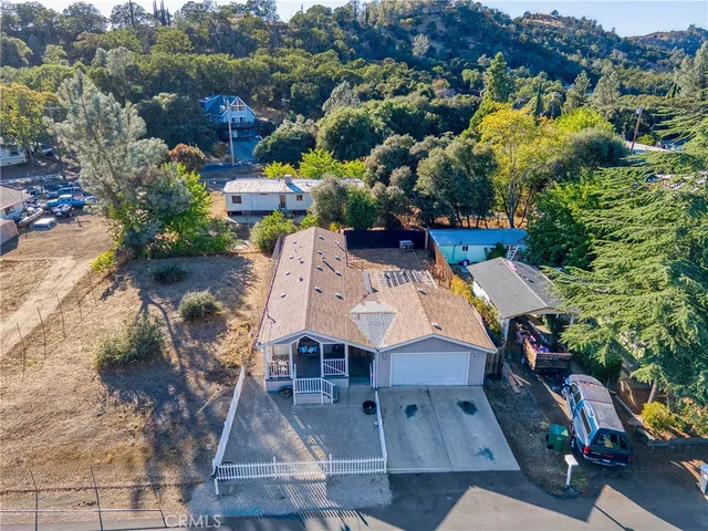 an aerial view of a house with a swimming pool