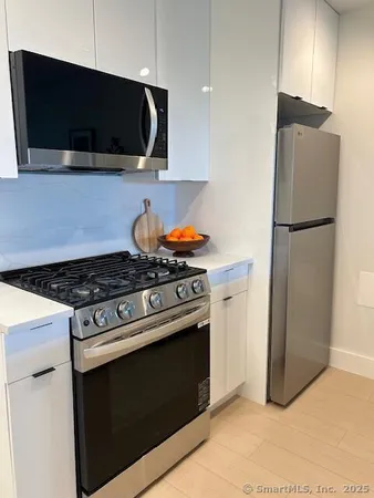 a kitchen with a stove and a microwave