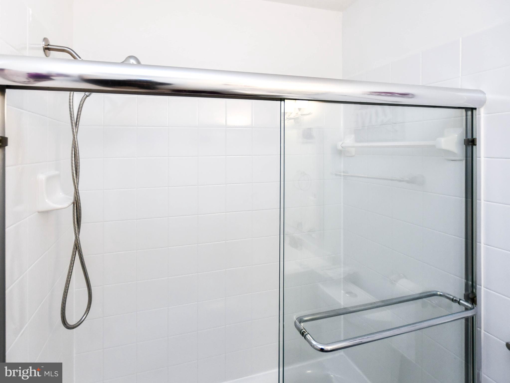 8317 Canning Terrace Greenbelt, MD 20770 - Photo 25 of 50 a bathroom with a shower