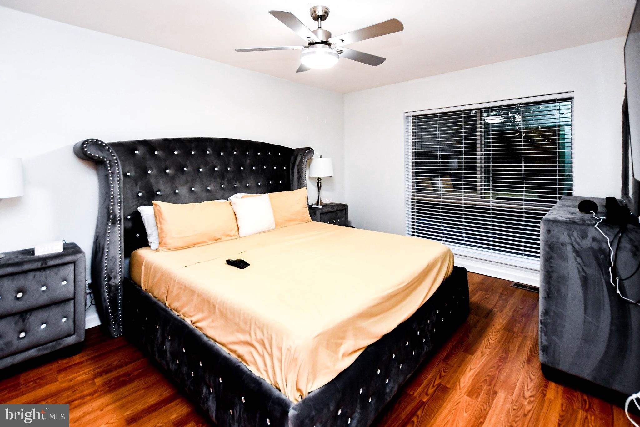 8317 Canning Terrace Greenbelt, MD 20770 - Photo 27 of 50 a bedroom with bed and window