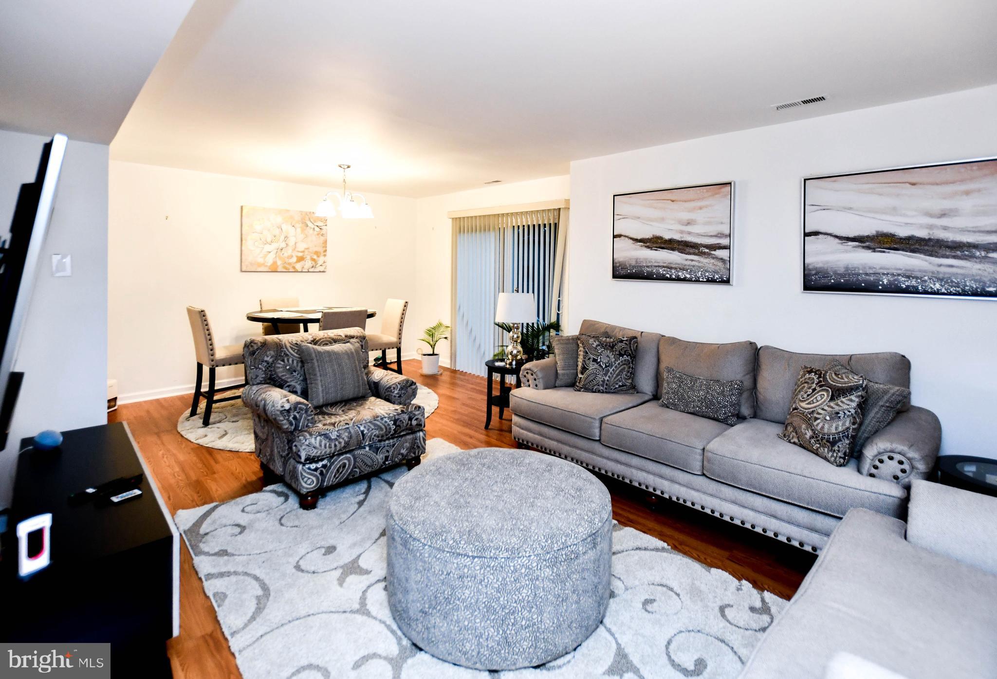 8317 Canning Terrace Greenbelt, MD 20770 - Photo 43 of 50 a living room with furniture and a couch