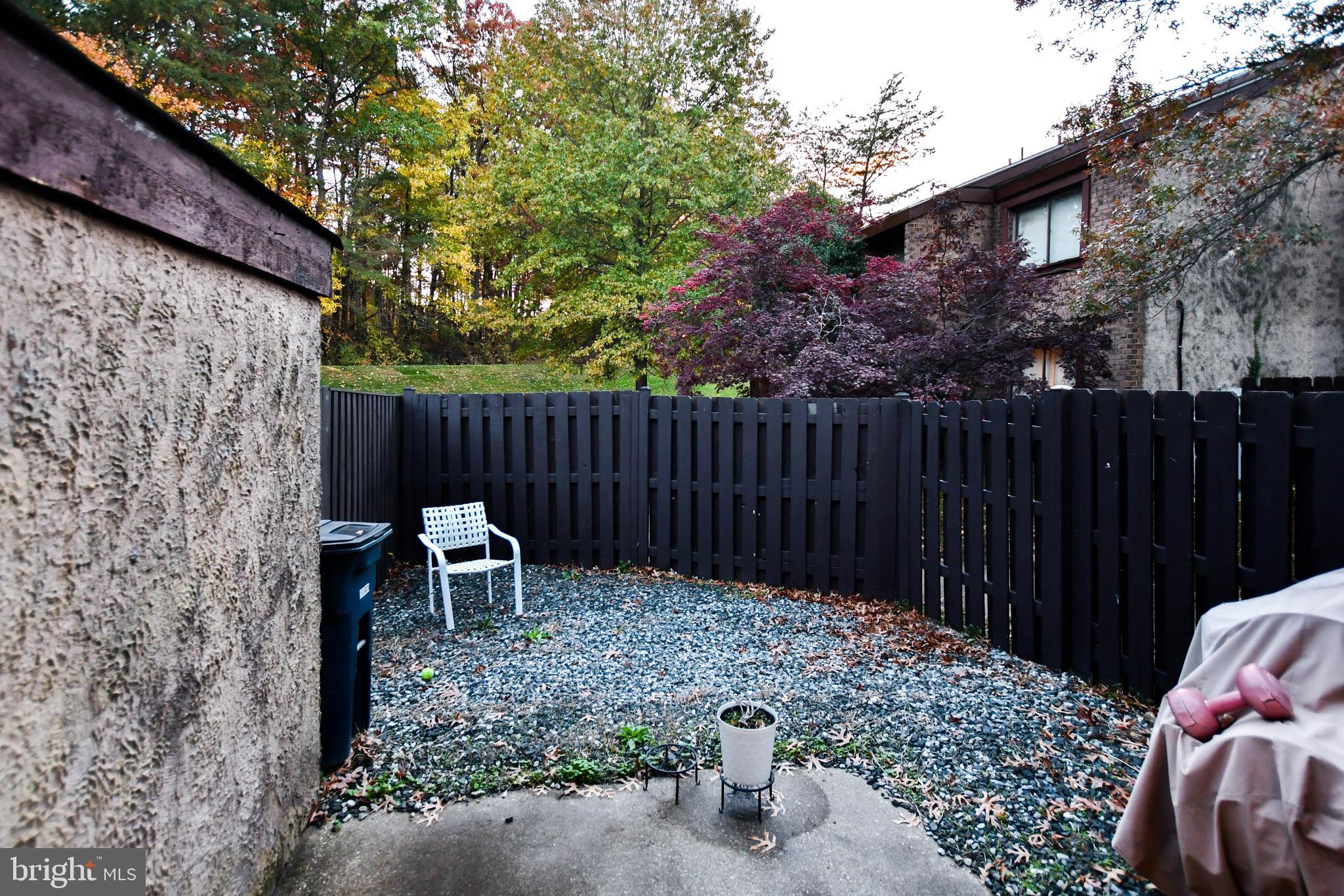 8317 Canning Terrace Greenbelt, MD 20770 - Photo 49 of 50 a backyard of a house with table and chairs
