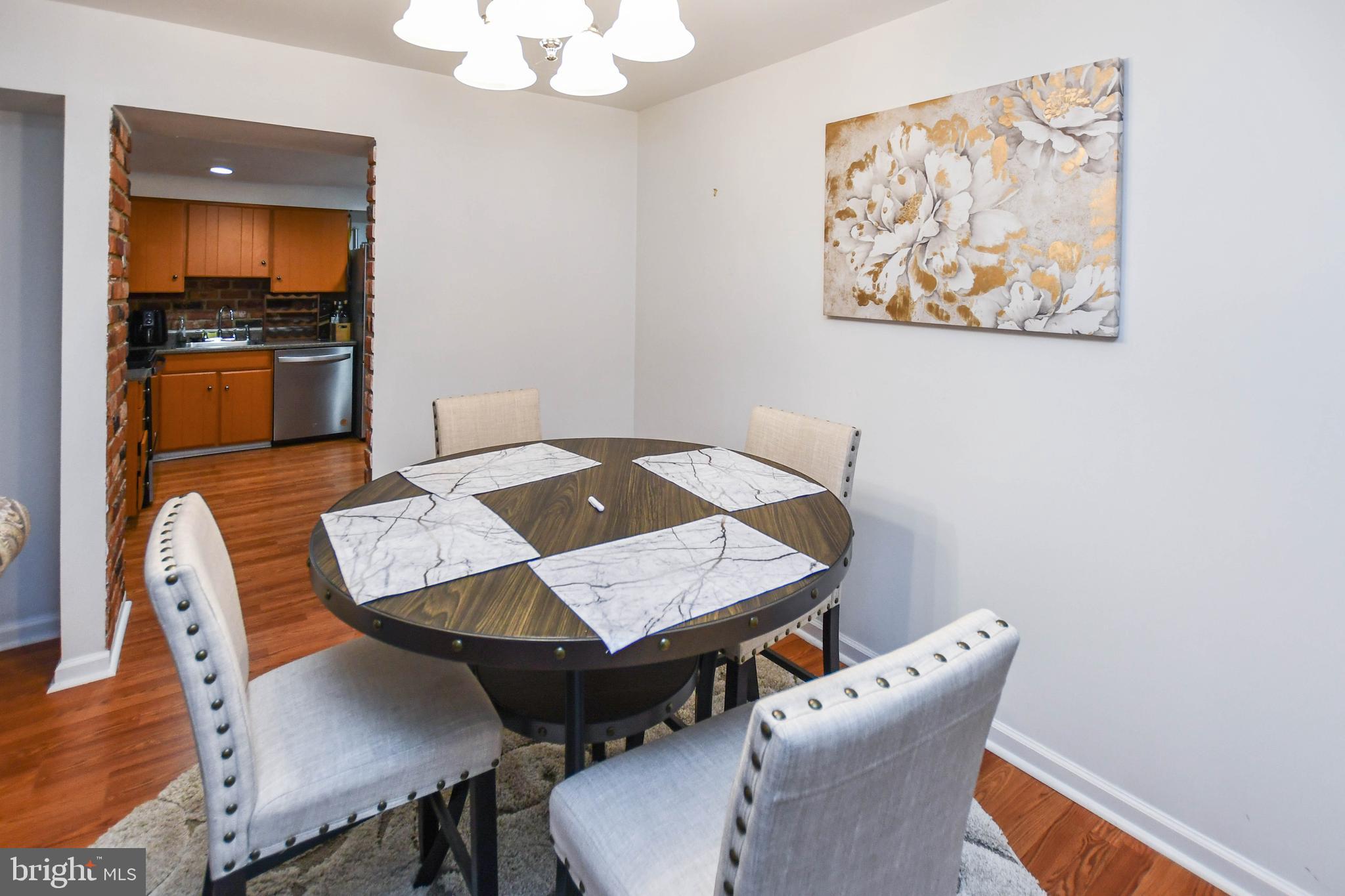8317 Canning Terrace Greenbelt, MD 20770 - Photo 7 of 50 a view of a dining room with furniture and wooden floor