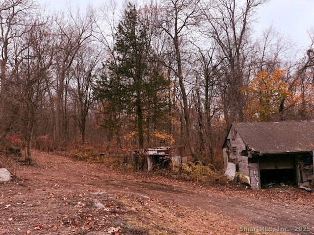 72 D Walnut Street Seymour, CT 06483 - Photo 8 of 9 a view of backyard with table and chairs and a fire pit