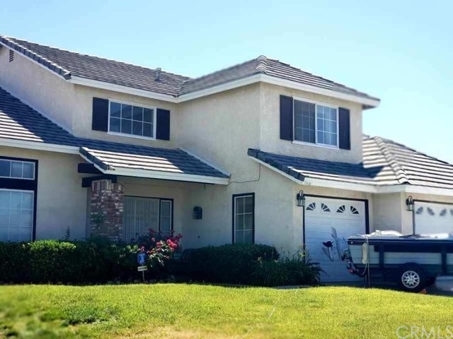 14605 Ponderosa Ranch Road Victorville, CA 92392 - Photo 1 of 1 a front view of a house with a yard