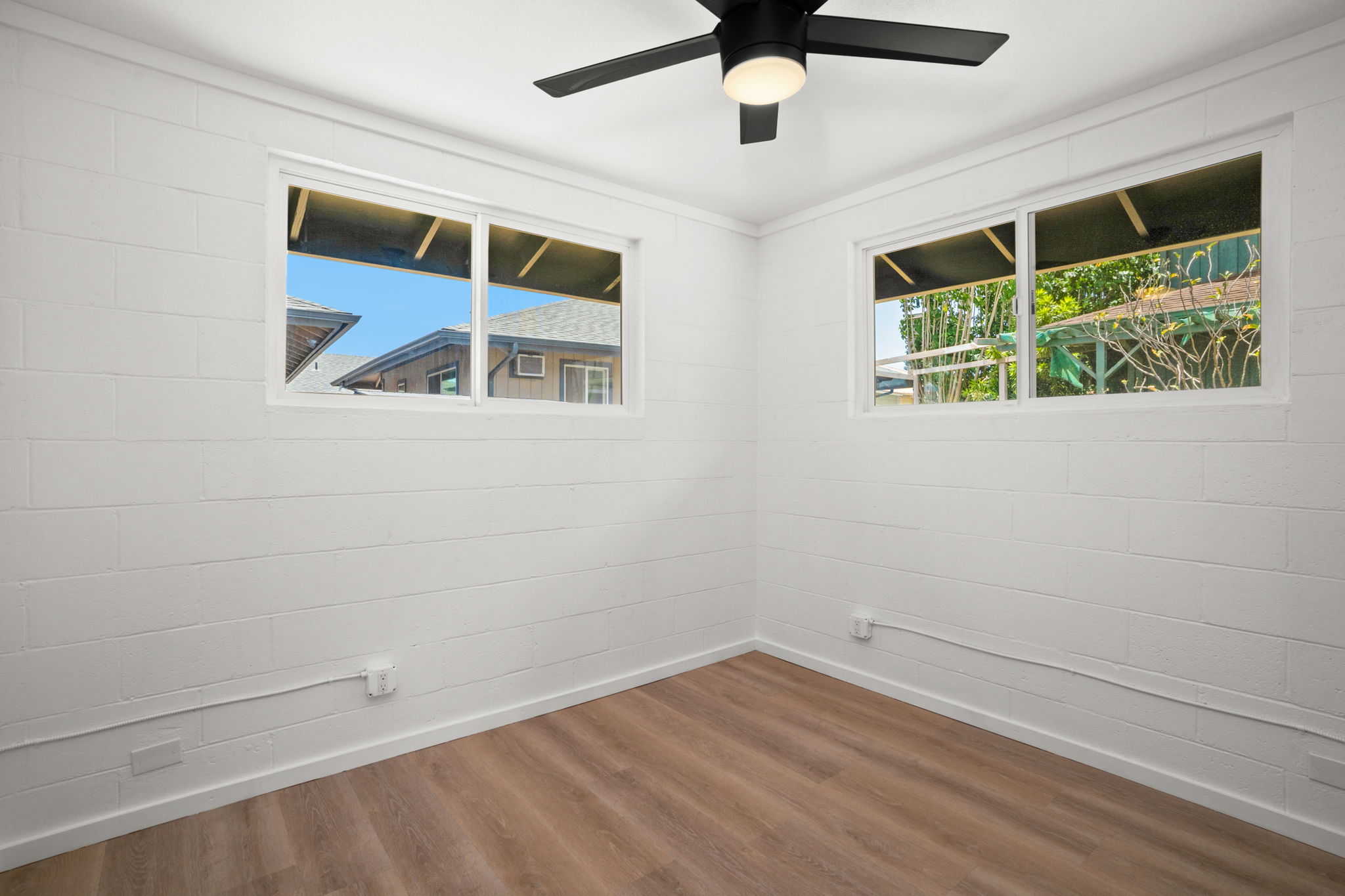 4484 Panako Road Waimea, HI 96796 - Photo 13 of 27 an empty room with wooden floor and windows