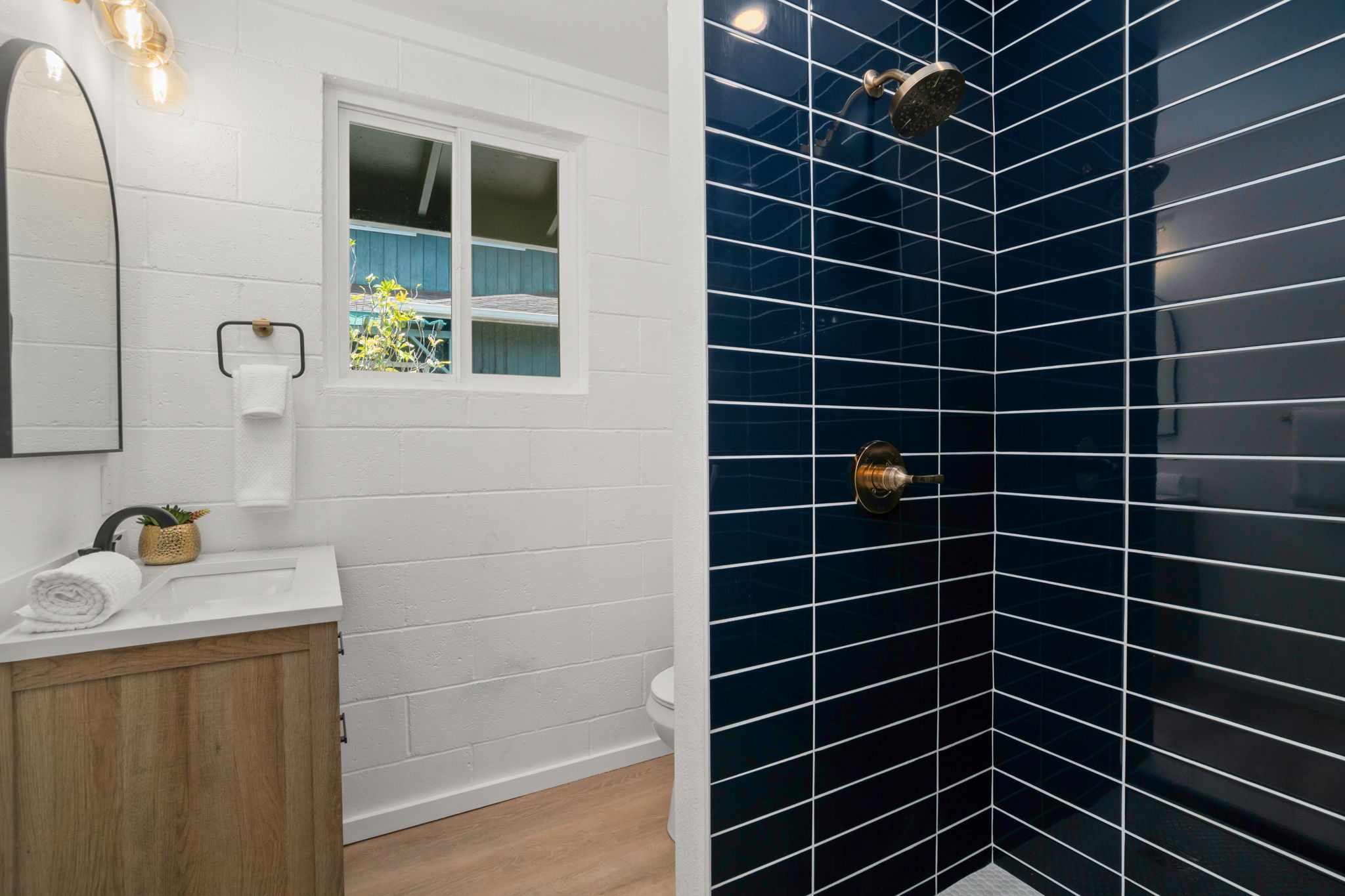 4484 Panako Road Waimea, HI 96796 - Photo 10 of 27 a bathroom with a sink toilet shower and a mirror