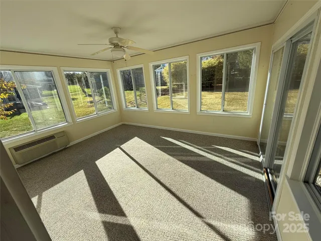 a black and white photo of a living room