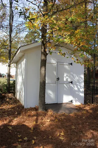 a view of a house with a tree