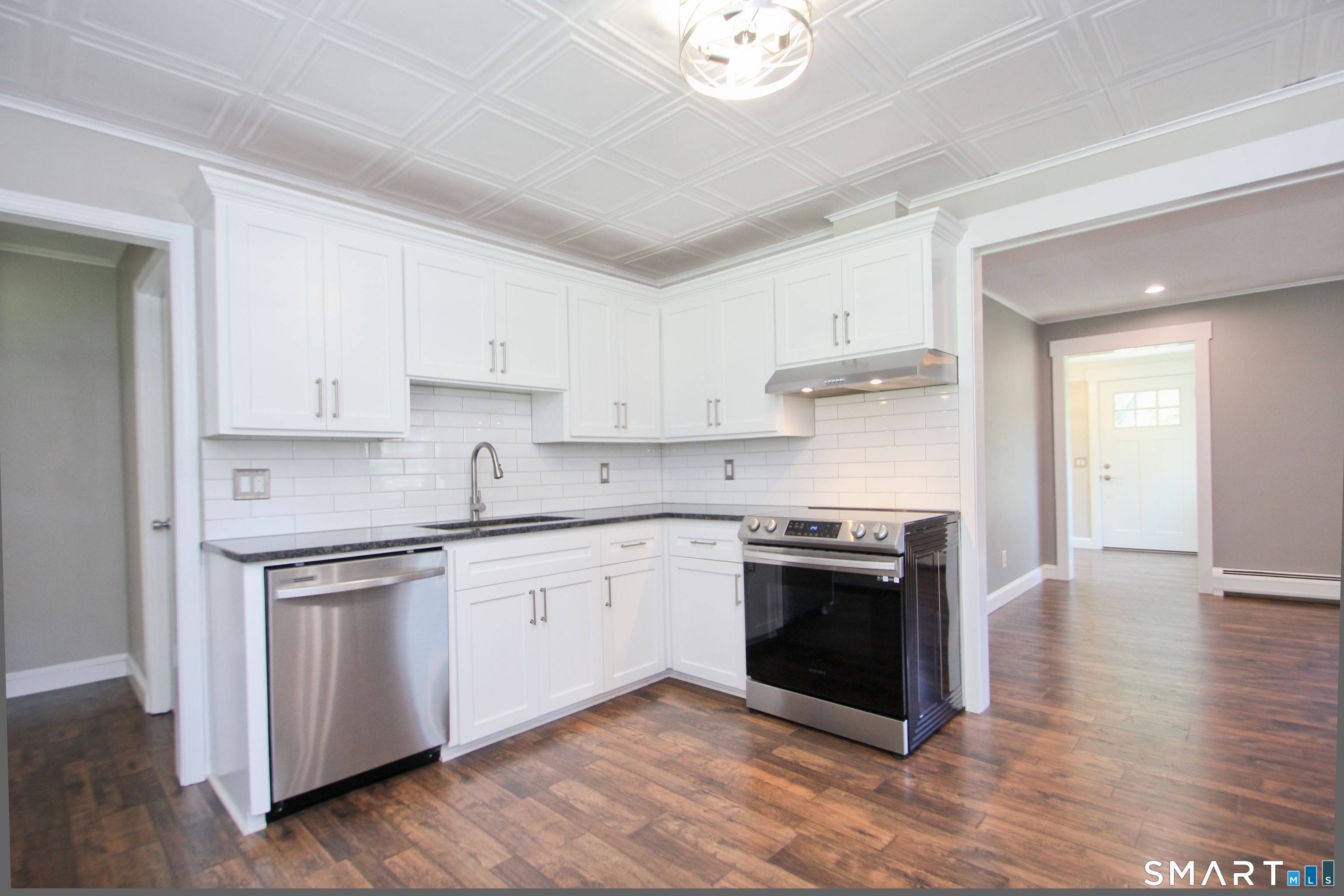 5 R Broad Hill Road Granby, CT 06090 - Photo 5 of 31 a kitchen with stainless steel appliances granite countertop a stove and a sink