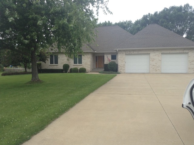 3105 East 1888th Road Ottawa, IL 61350 - Photo 1 of 11 a front view of a house with a garden and trees
