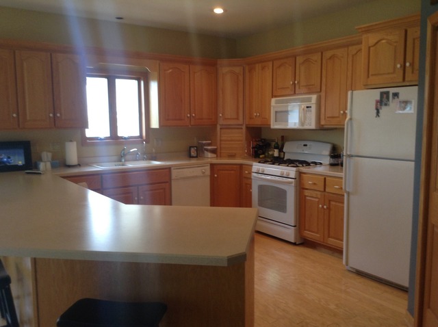 3105 East 1888th Road Ottawa, IL 61350 - Photo 4 of 11 a kitchen with stainless steel appliances granite countertop a refrigerator a sink a stove a microwave and island