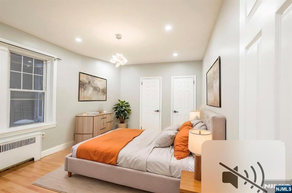 155 Union Avenue, Unit 201 Rutherford, NJ 07070 - Photo 13 of 15 a bedroom with a large bed and a window
