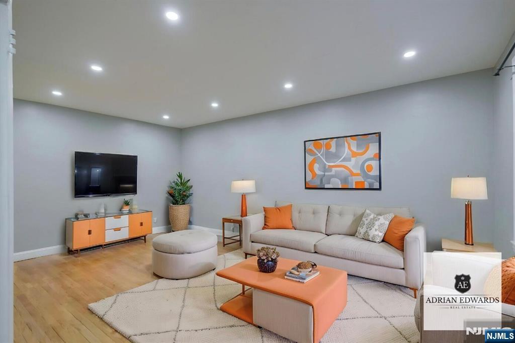 155 Union Avenue, Unit 201 Rutherford, NJ 07070 - Photo 15 of 15 a living room with furniture and a flat screen tv