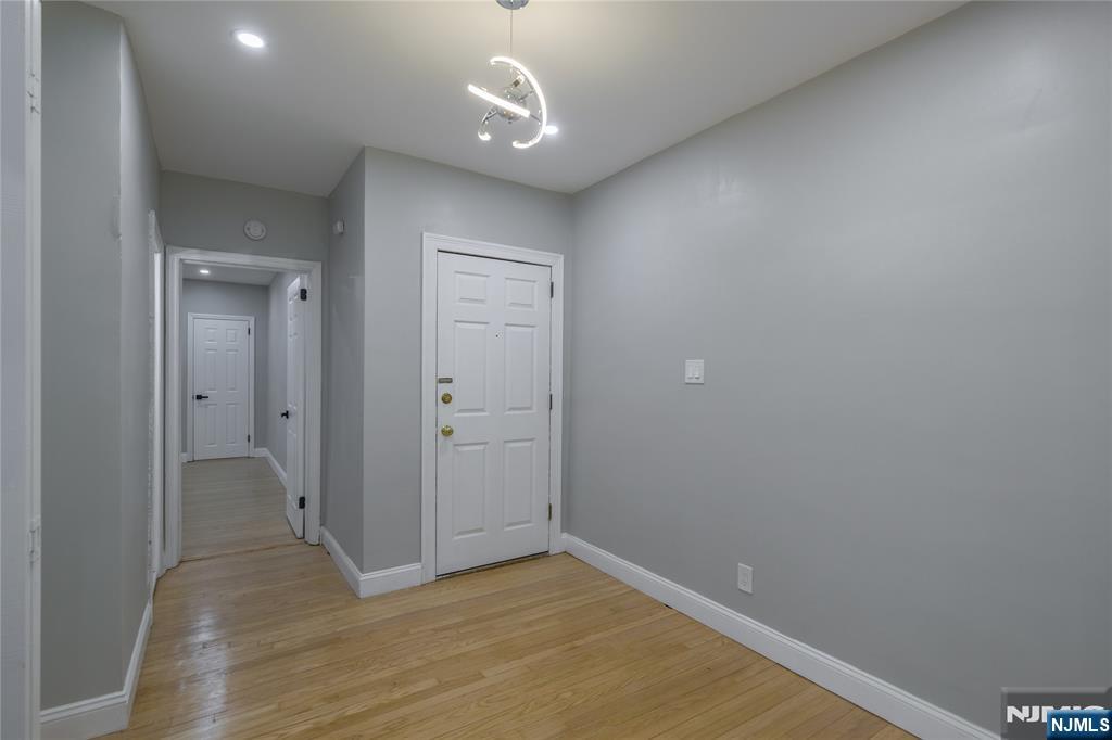 155 Union Avenue, Unit 201 Rutherford, NJ 07070 - Photo 3 of 15 wooden floor in an empty room