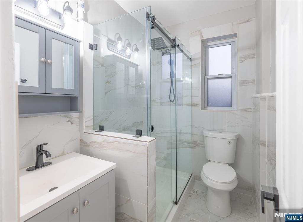 155 Union Avenue, Unit 201 Rutherford, NJ 07070 - Photo 5 of 15 a bathroom with a sink toilet and shower