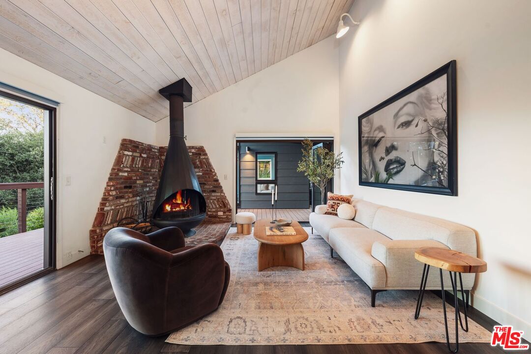 19806 Valley View Drive Topanga, CA 90290 - Photo 27 of 66 a living room with furniture and a large window