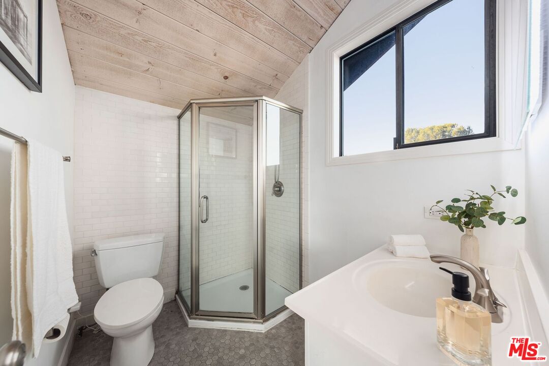 19806 Valley View Drive Topanga, CA 90290 - Photo 41 of 66 a bathroom with a sink toilet and shower
