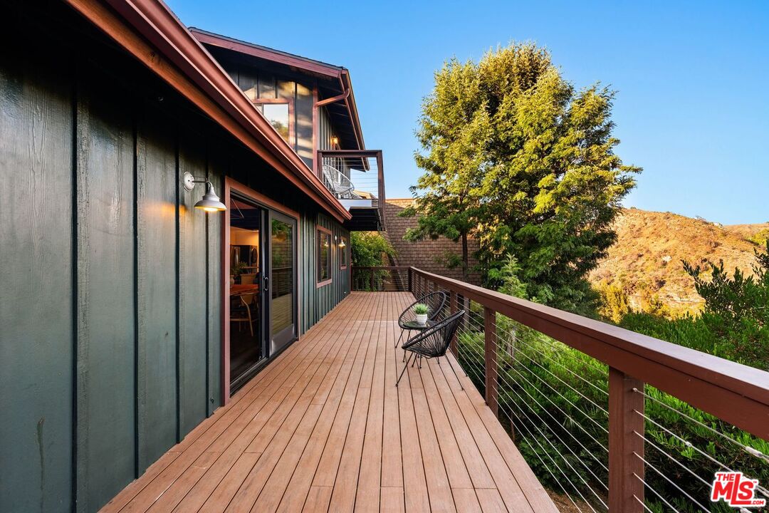 19806 Valley View Drive Topanga, CA 90290 - Photo 44 of 66 a view of balcony with wooden floor and fence
