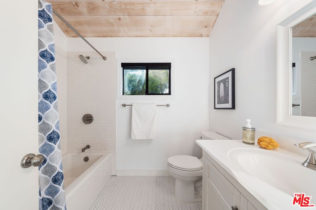 19806 Valley View Drive Topanga, CA 90290 - Photo 57 of 66 a bathroom with a sink a toilet and shower