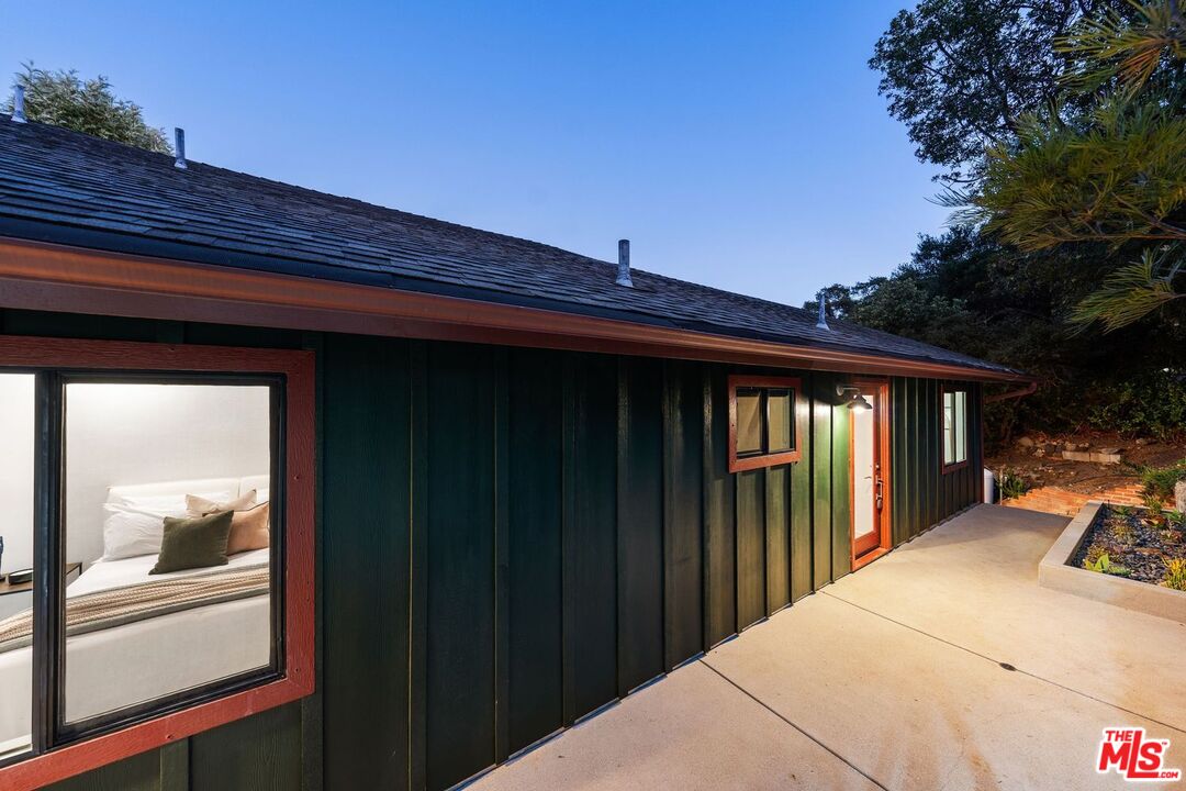 19806 Valley View Drive Topanga, CA 90290 - Photo 62 of 66 a front view of a house with a yard